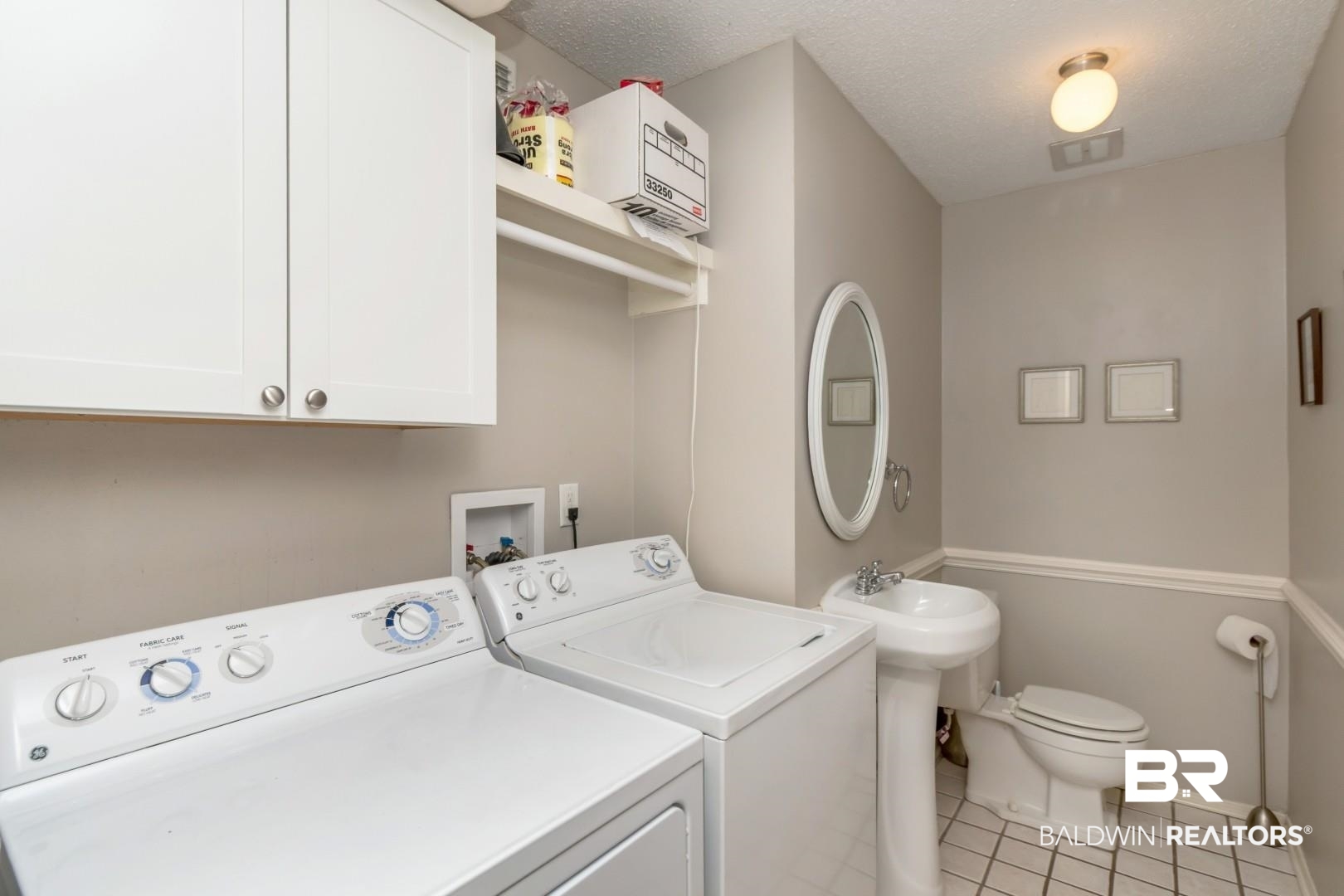 118 Du Rhu Drive, Unit H Mobile, AL 36608 - Photo 11 of 19 Practical utility room with a pedestal sink, toilet, and white tile flooring