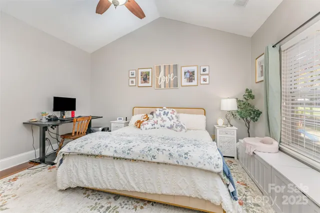 a bedroom with a bed and a table