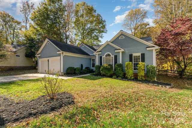 a house with a large pool in front of it