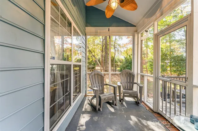 a view of a room with chairs and table in the balcony