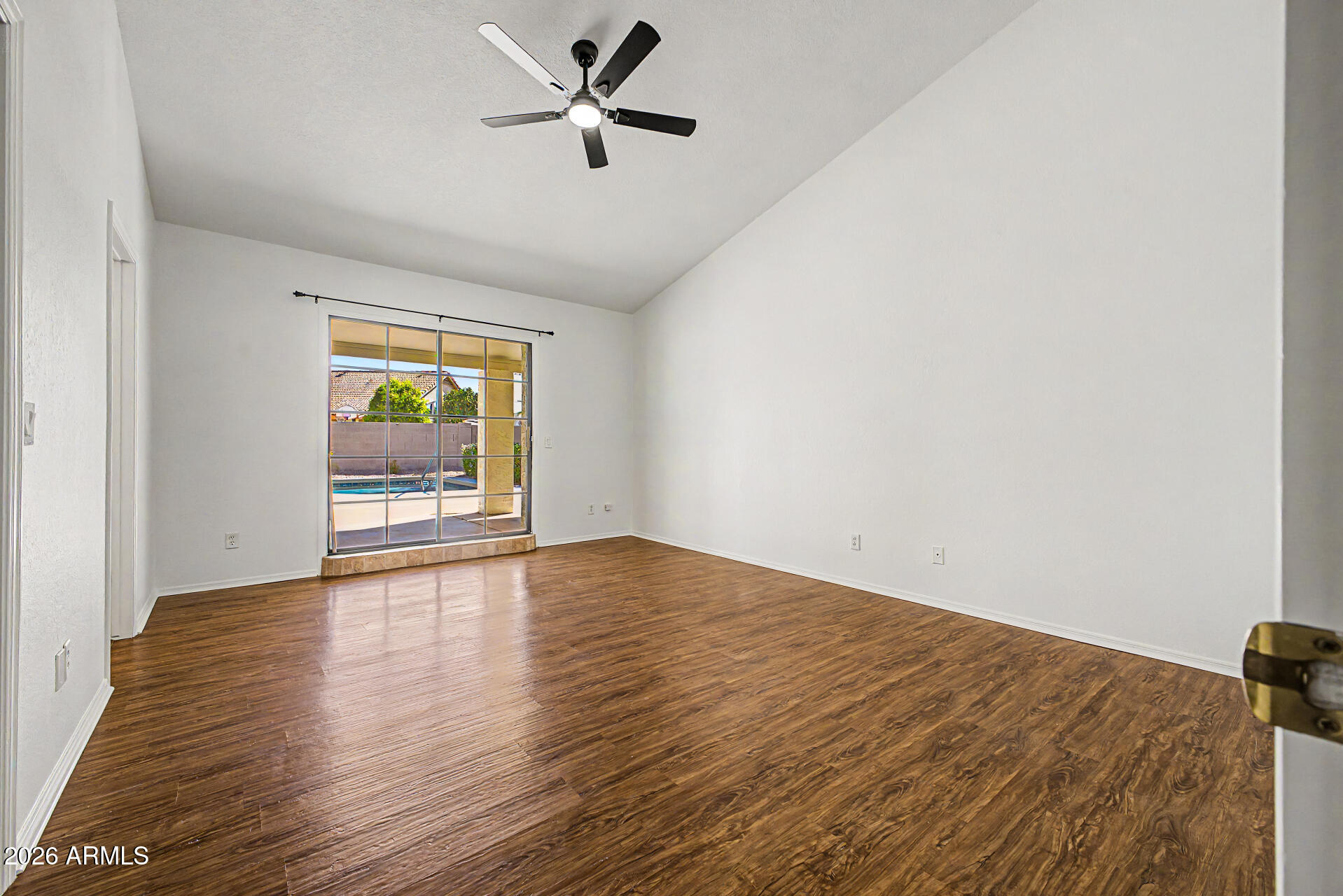 6725 West Utopia Road Glendale, AZ 85308 - Photo 12 of 27 a view of empty room with wooden floor and fan