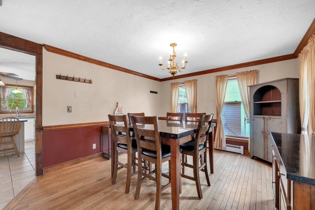 157 Podunk Road Sturbridge, MA 01566 - Photo 18 of 42 a view of a dining room with furniture and wooden floor