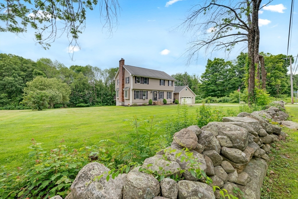 157 Podunk Road Sturbridge, MA 01566 - Photo 4 of 42 a view of a house with a yard