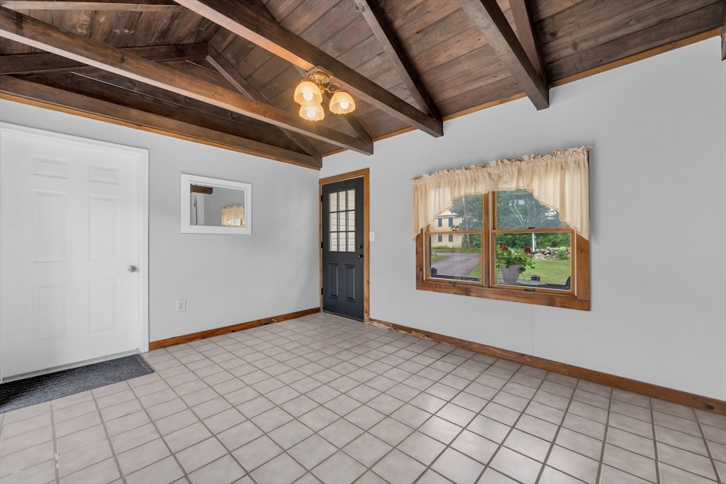 157 Podunk Road Sturbridge, MA 01566 - Photo 5 of 42 a view of an empty room with window