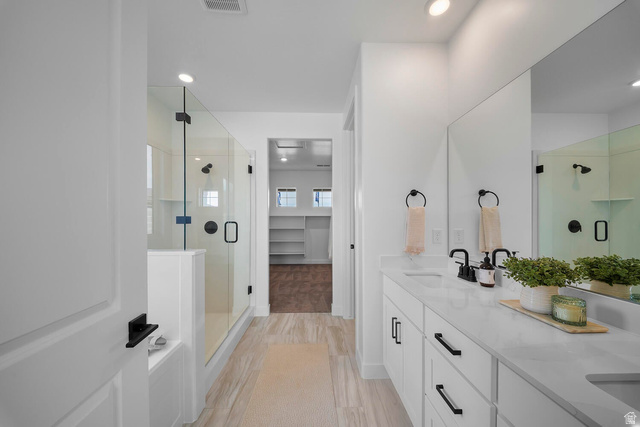 382 North Rhyolite Drive, Unit 111 Hurricane, UT 84737 - Photo 11 of 37 Contemporary bathroom featuring dual vanities with white cabinetry and quartz countertops