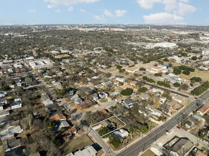 an aerial view of residential building with parking space