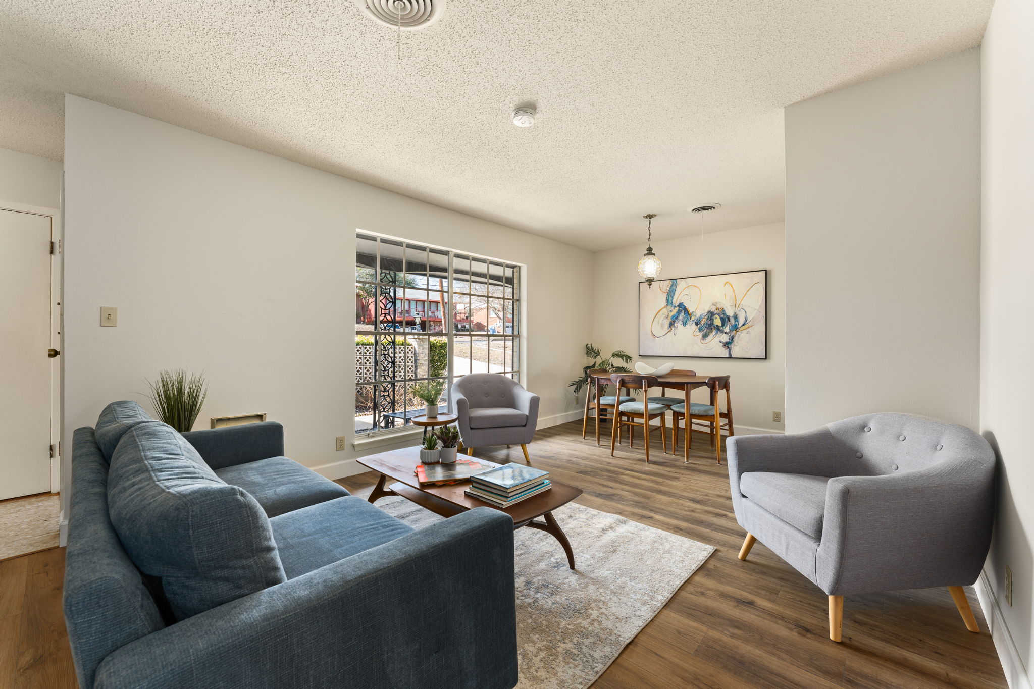 1903 Maple Avenue Austin, TX 78722 - Photo 3 of 39 The living room/dining room combination is light and bright.