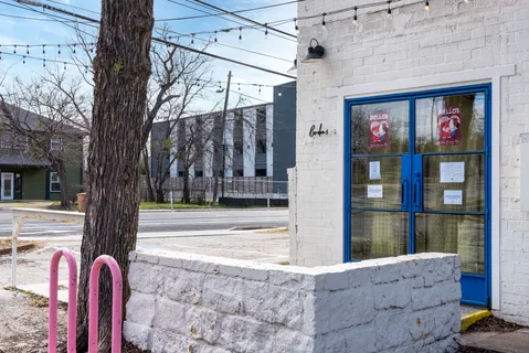 a view of front door of house and car parked
