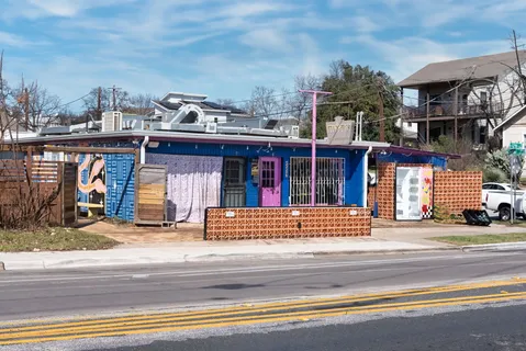 a view of a building and a people on a street