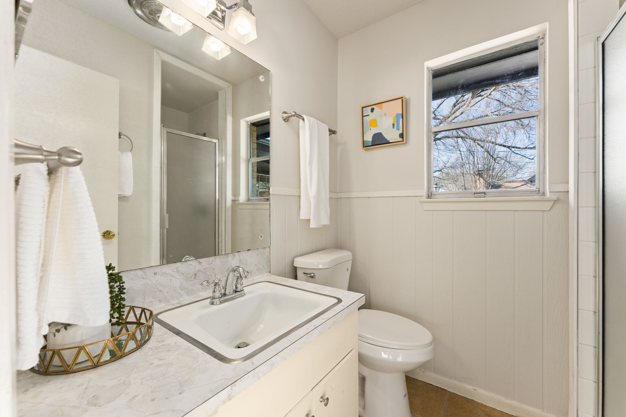 1903 Maple Avenue Austin, TX 78722 - Photo 7 of 39 The primary bathroom has a walk-in shower.