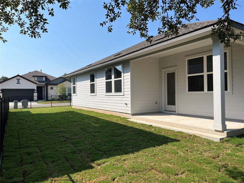 130 Spangle Way Kyle, TX 78640 - Photo 22 of 28 a front view of a house with a garden