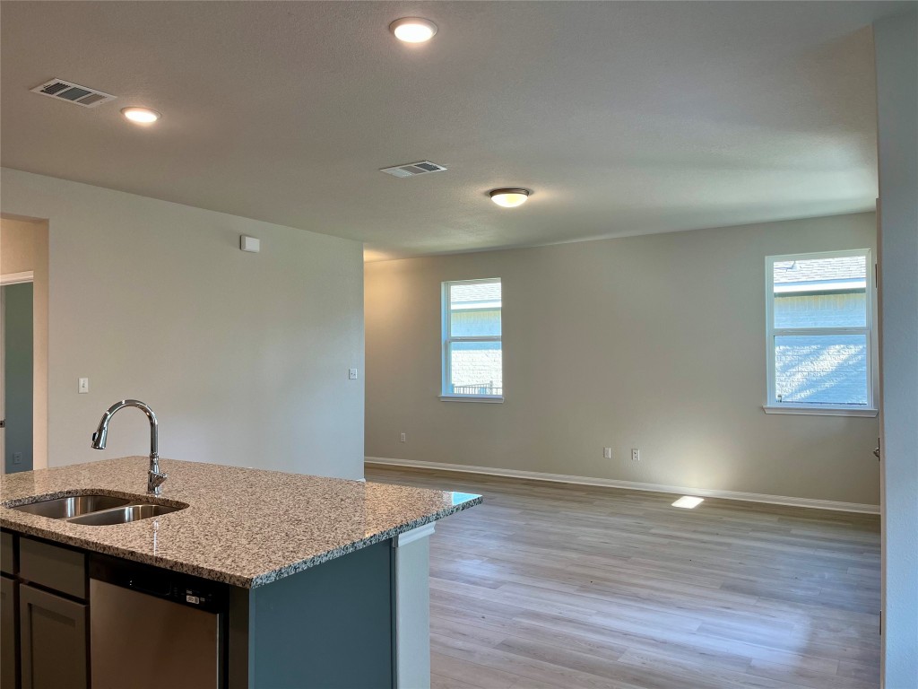130 Spangle Way Kyle, TX 78640 - Photo 9 of 28 a bathroom with a sink and vanity