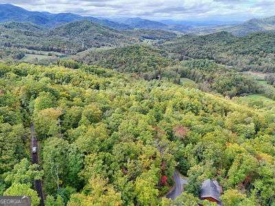 Lot 28 Skyview Drive Hayesville, NC 28904 - Photo 2 of 14 a view of a lush green forest with trees and some houses