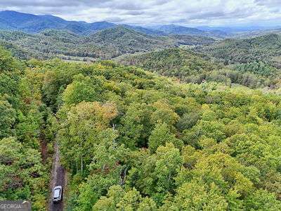 Lot 28 Skyview Drive Hayesville, NC 28904 - Photo 7 of 14 a view of a lush green forest with trees and houses