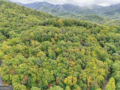 Lot 28 Skyview Drive Hayesville, NC 28904 - Photo 9 of 14 a view of a lush green hillside and a houses