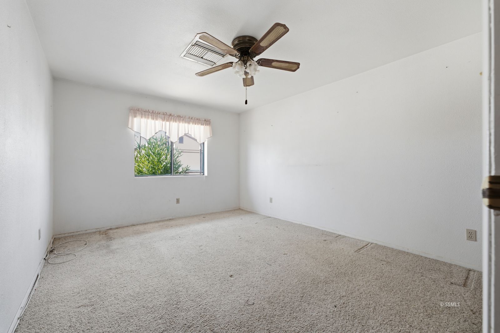 3443 3rd Street Inyokern, CA 93527 - Photo 15 of 24 an empty room with ceiling fan and window