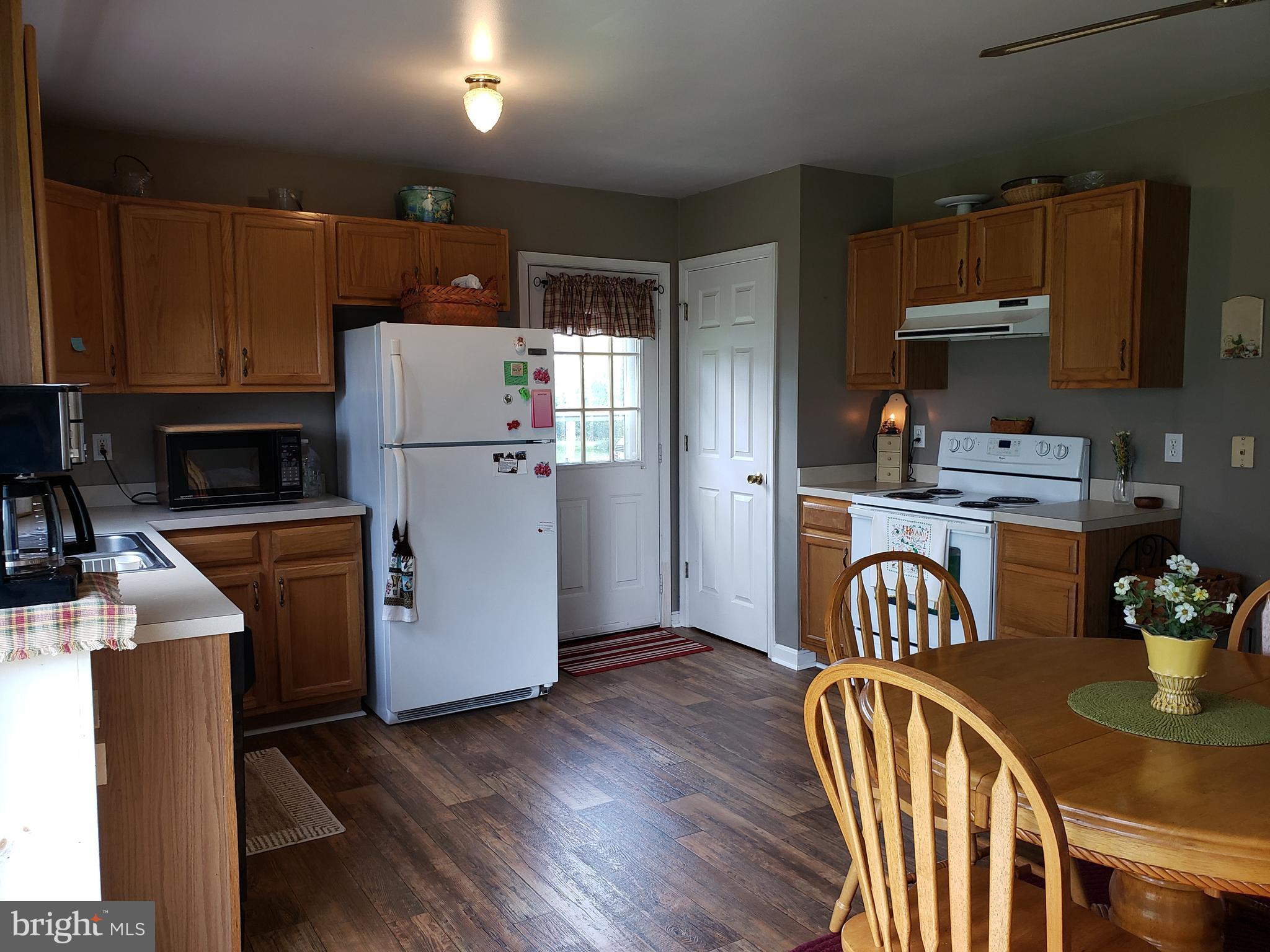 4 Oak Street Ridgely, MD 21660 - Photo 12 of 28 Kitchen and side door entrance - pantry far right.