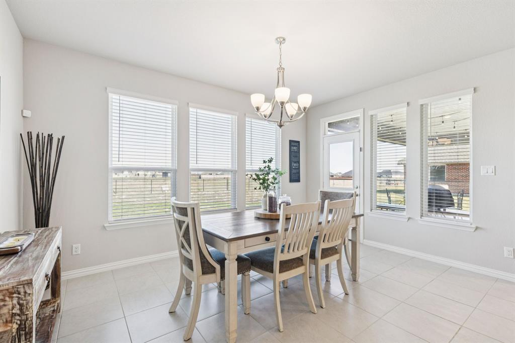 118 Mossy Creek Trail Rhome, TX 76078 - Photo 16 of 28 a view of a dining room with furniture window and outside view
