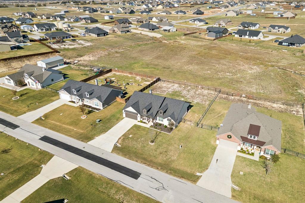 118 Mossy Creek Trail Rhome, TX 76078 - Photo 26 of 28 an aerial view of residential houses with outdoor space