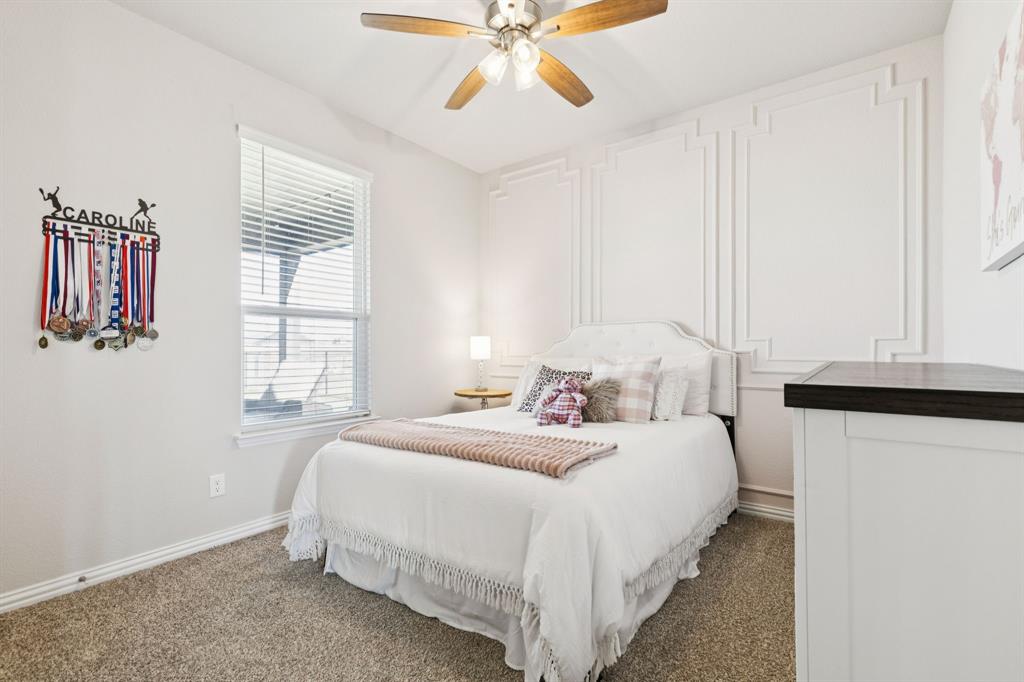 118 Mossy Creek Trail Rhome, TX 76078 - Photo 9 of 28 a bedroom with a bed and a window