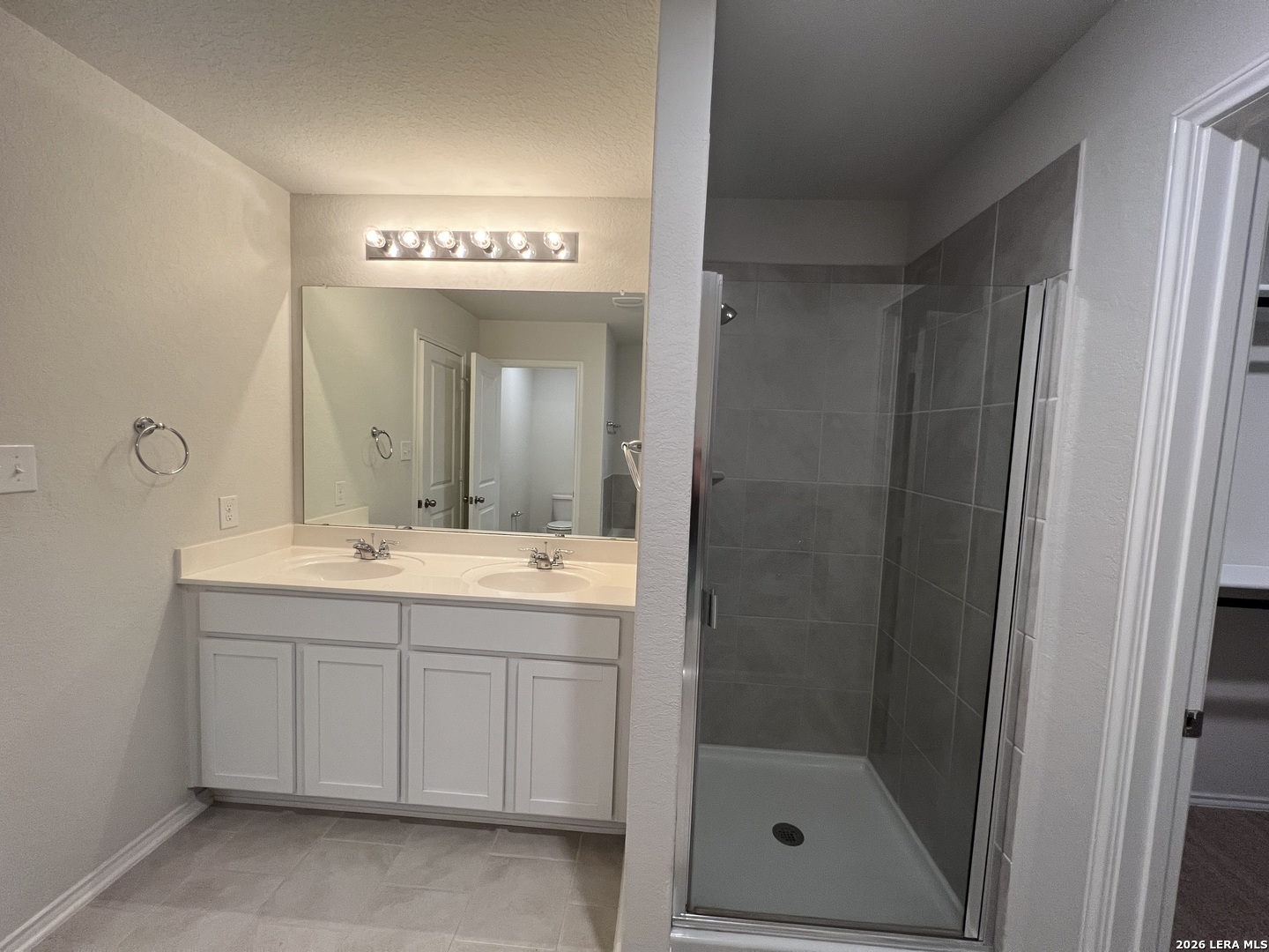 29529 Spring Copper Bulverde, TX 78163 - Photo 37 of 41 a spacious bathroom with a shower sink and mirror