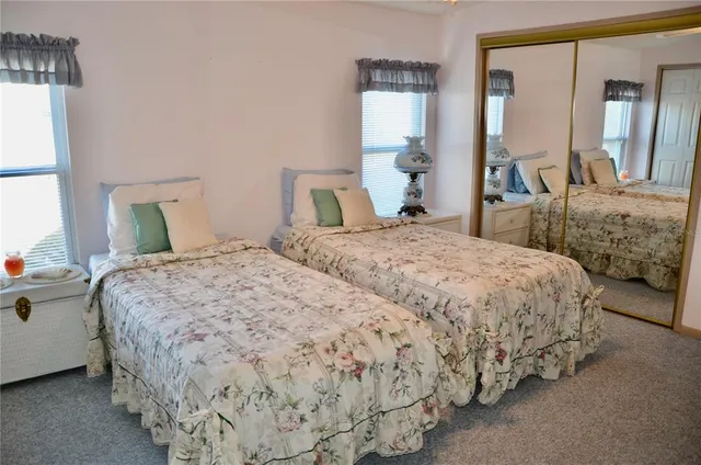 a bedroom with bed and window