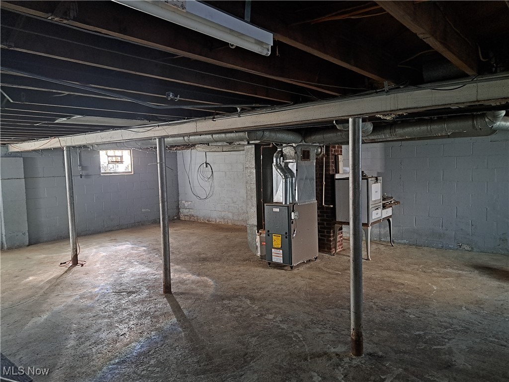 2245 North Ridge Road Lorain, OH 44055 - Photo 22 of 24 Basement with heating unit
