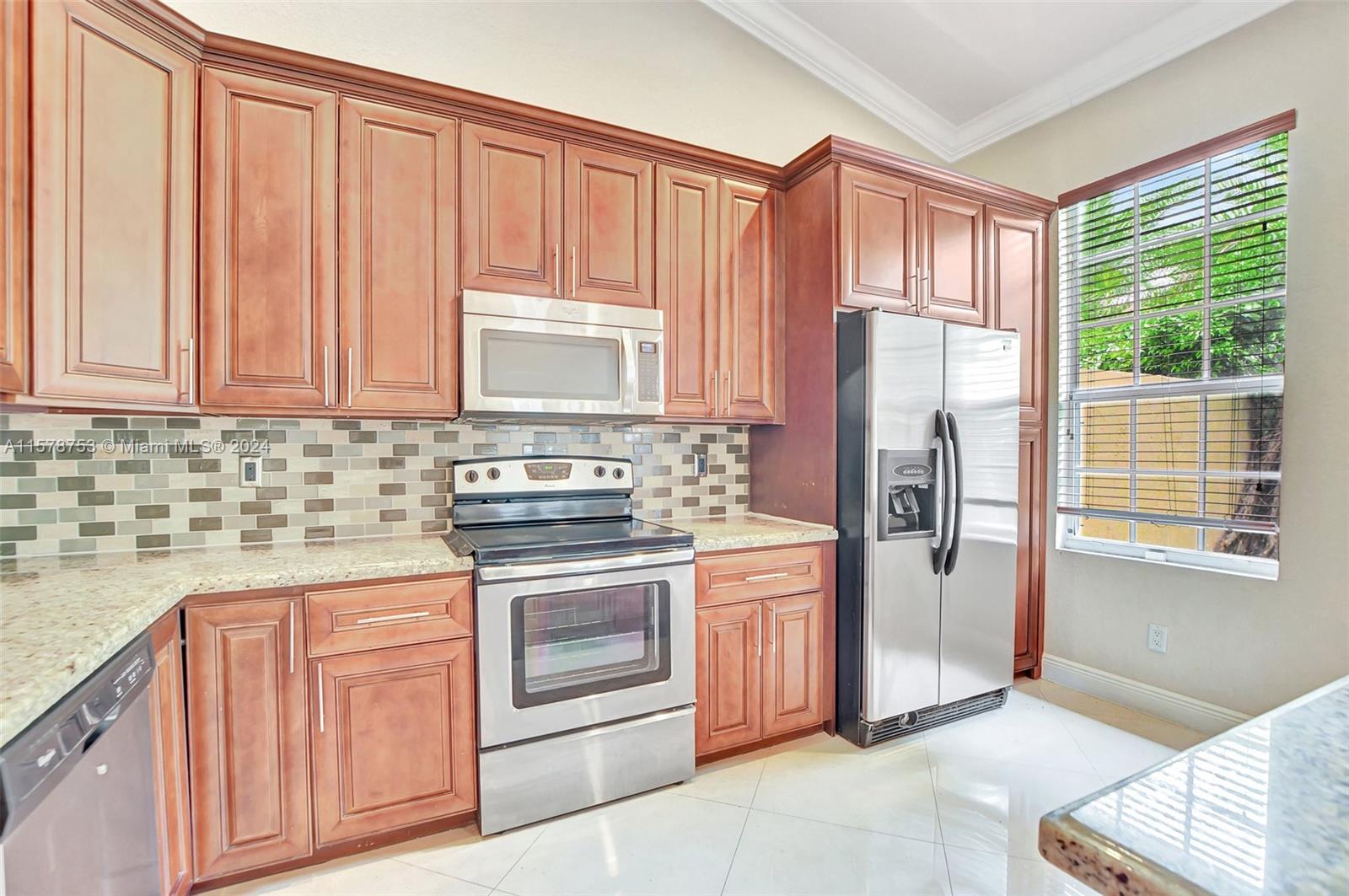 20916 Avenel Run Boca Raton, FL 33428 - Photo 15 of 43 a kitchen with stainless steel appliances granite countertop a refrigerator sink and stove