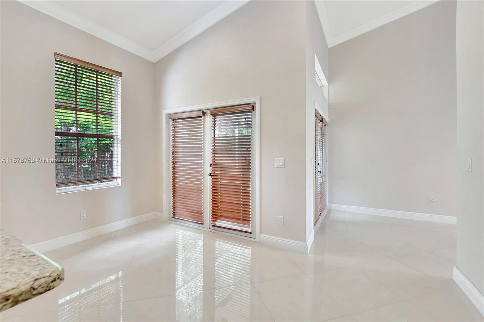 20916 Avenel Run Boca Raton, FL 33428 - Photo 17 of 43 an empty room with windows