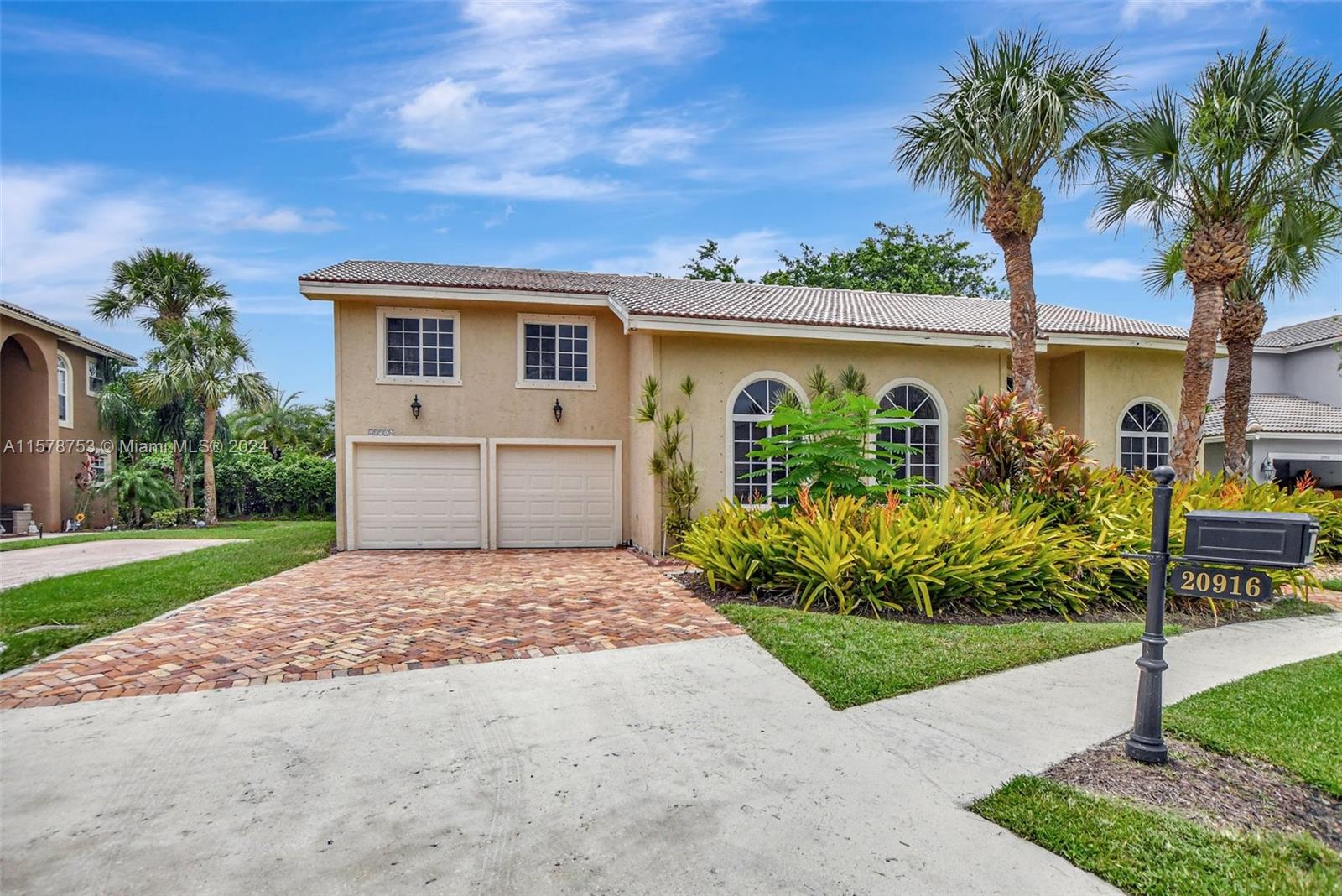 20916 Avenel Run Boca Raton, FL 33428 - Photo 2 of 43 a front view of a house with garden