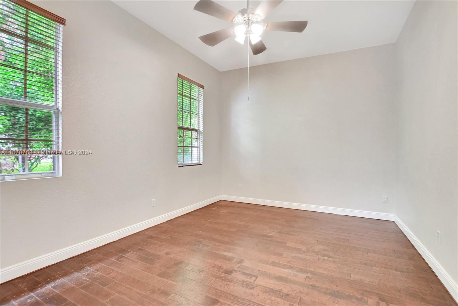 20916 Avenel Run Boca Raton, FL 33428 - Photo 25 of 43 an empty room with windows and fan