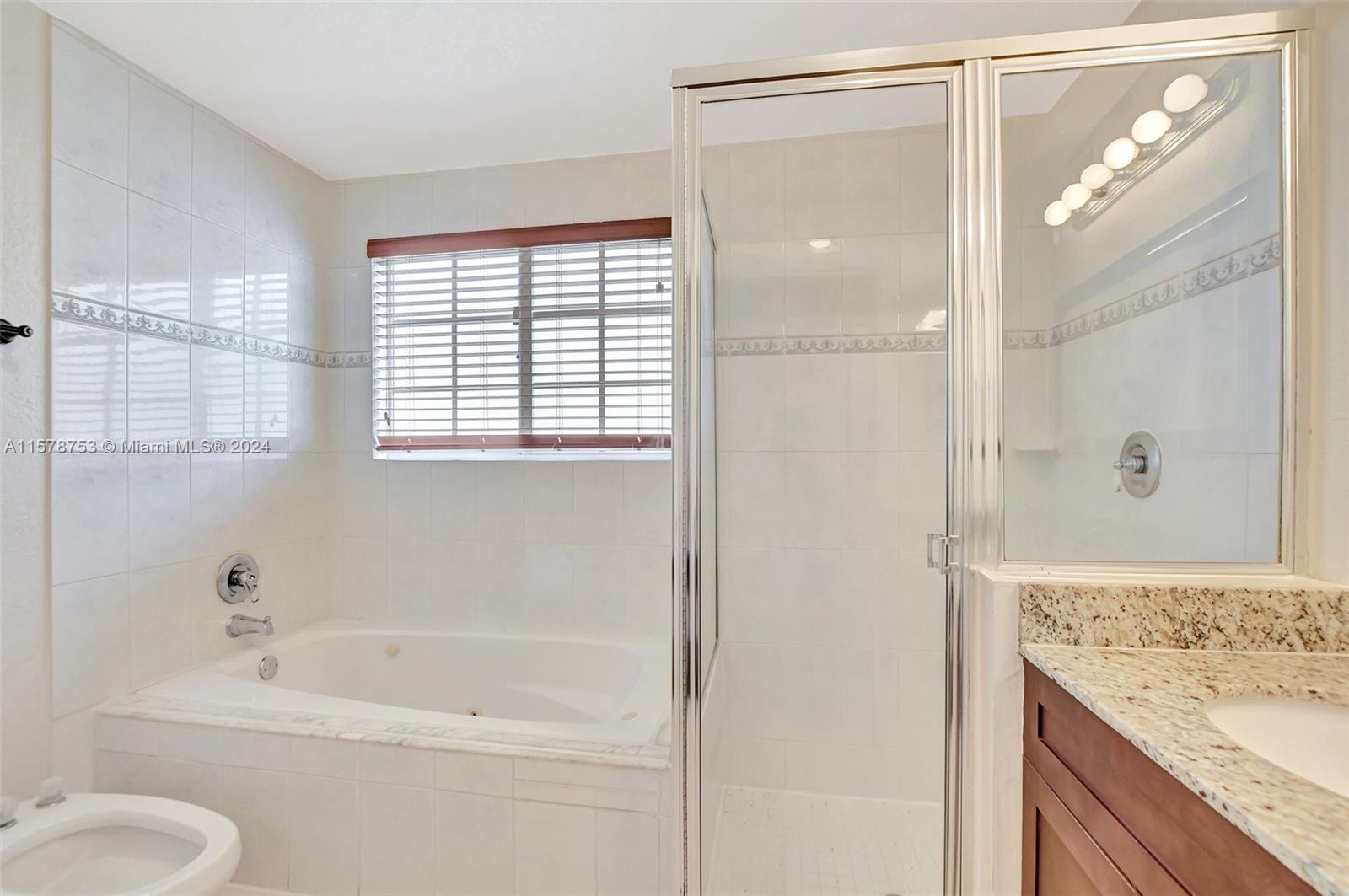 20916 Avenel Run Boca Raton, FL 33428 - Photo 27 of 43 a bathroom with a granite countertop tub sink and mirror
