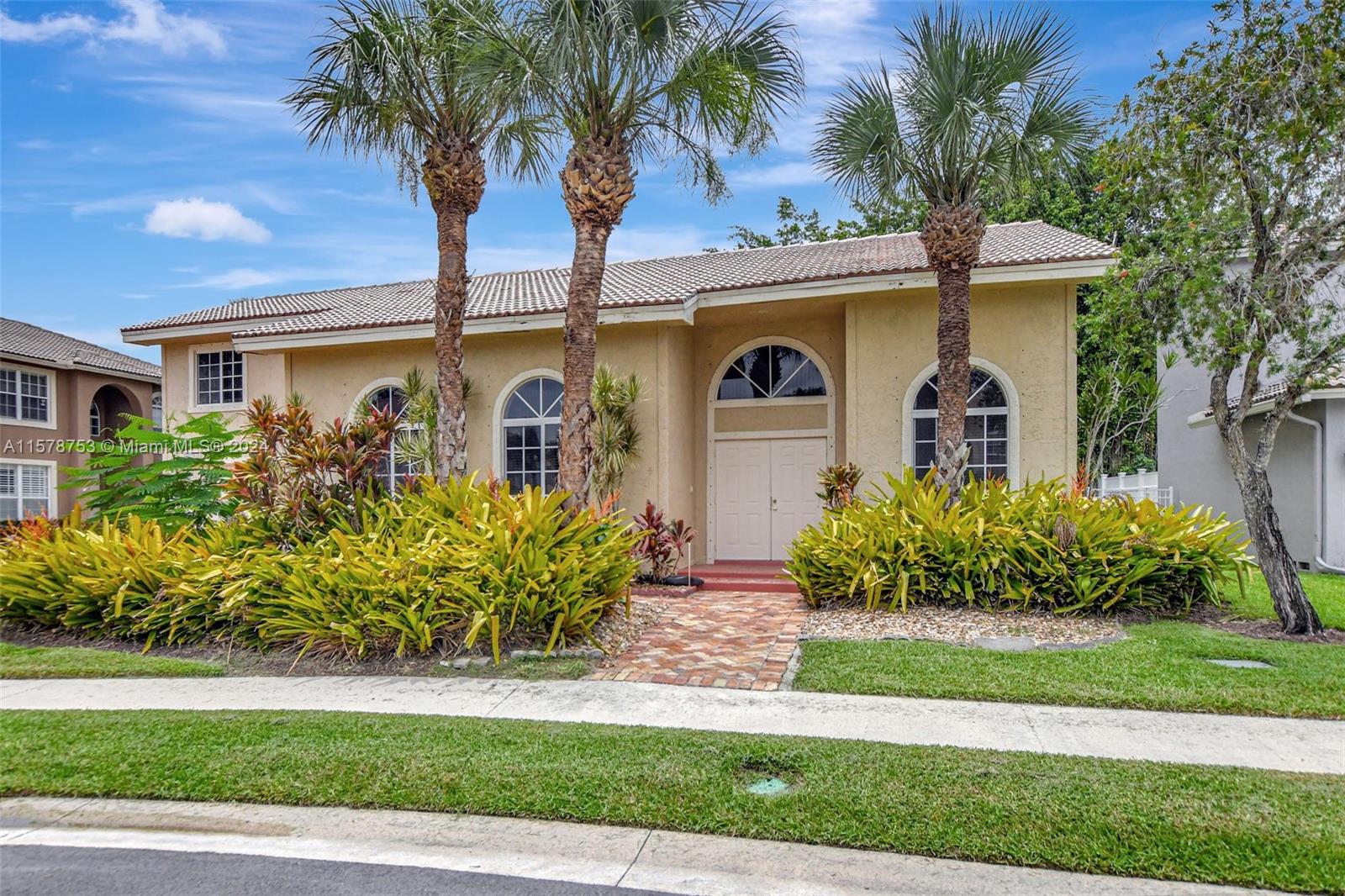20916 Avenel Run Boca Raton, FL 33428 - Photo 3 of 43 a front view of a house with garden