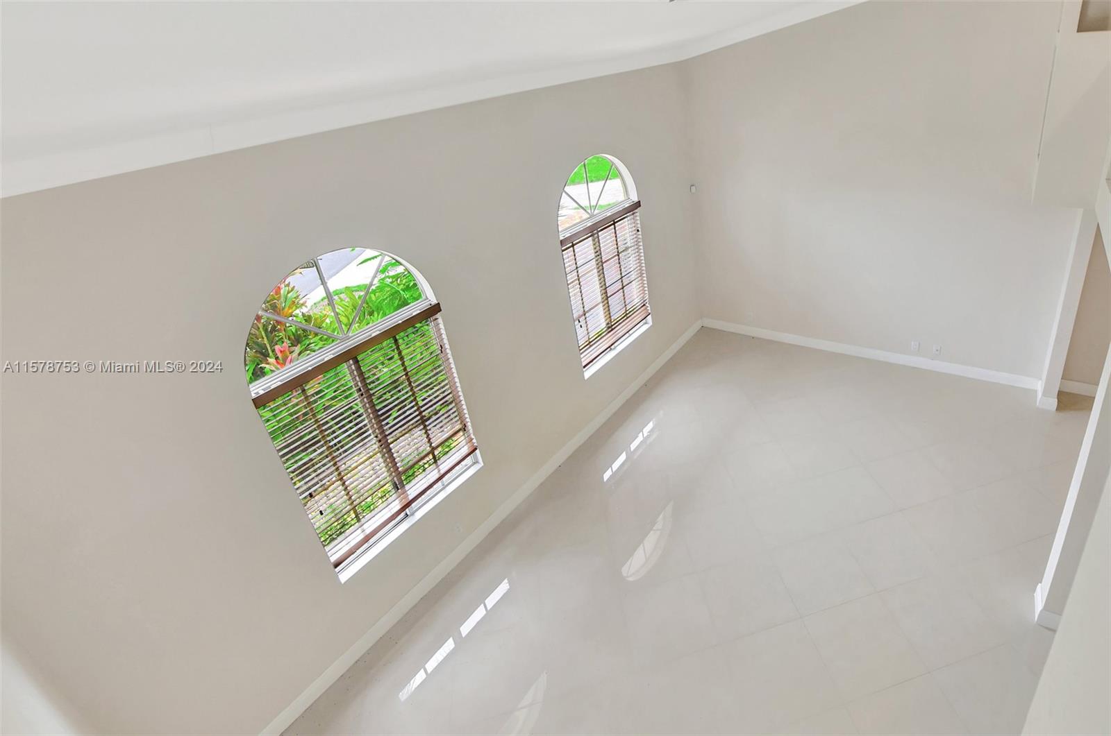 20916 Avenel Run Boca Raton, FL 33428 - Photo 38 of 43 a view of entryway with a window and a living room