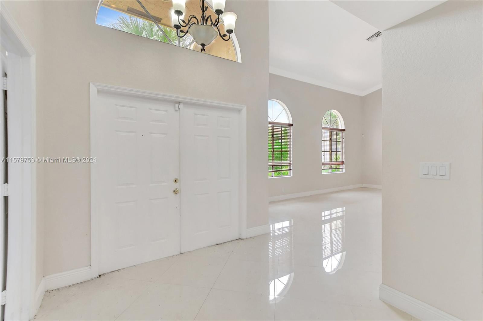 20916 Avenel Run Boca Raton, FL 33428 - Photo 4 of 43 a view of empty room with windows