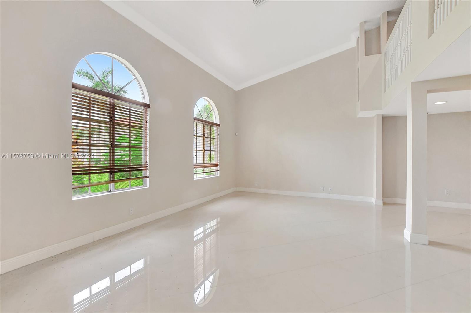 20916 Avenel Run Boca Raton, FL 33428 - Photo 6 of 43 a view of an empty room with a window