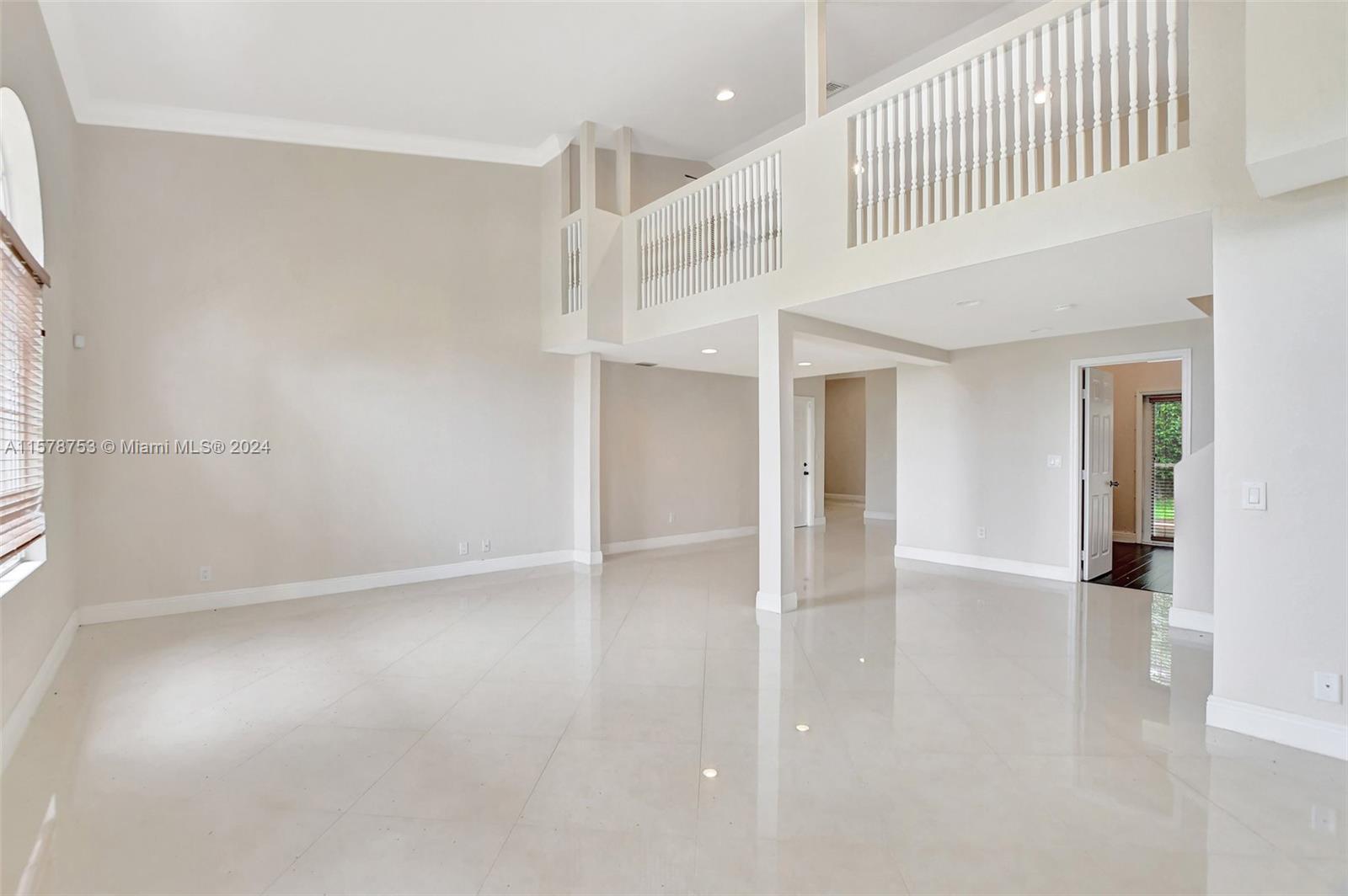 20916 Avenel Run Boca Raton, FL 33428 - Photo 7 of 43 an empty room with windows