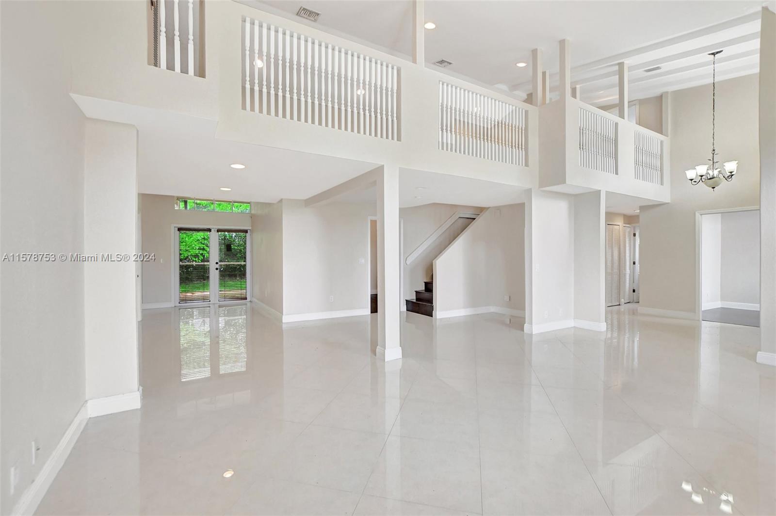 20916 Avenel Run Boca Raton, FL 33428 - Photo 8 of 43 a view of an entryway with wooden floor