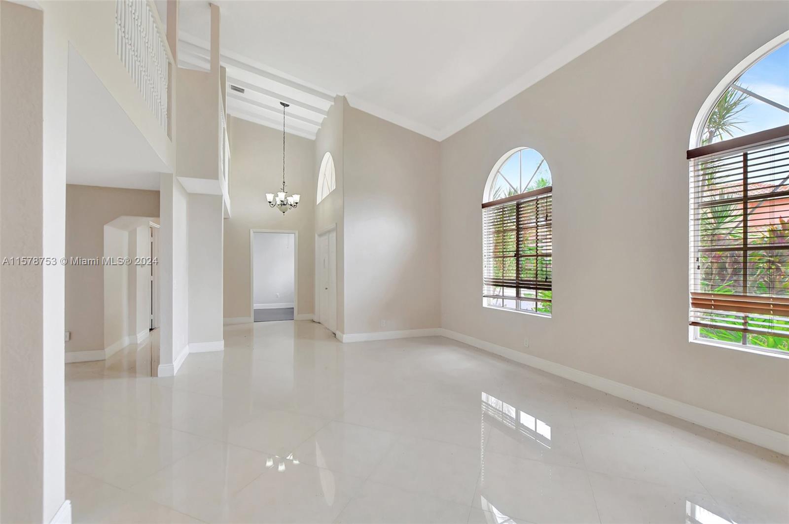 20916 Avenel Run Boca Raton, FL 33428 - Photo 9 of 43 a view of empty room with wooden floor and fan