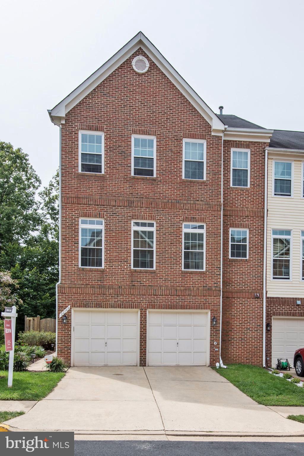 20709 Riptide Square Sterling, VA 20165 - Photo 1 of 30 a front view of a house with garage