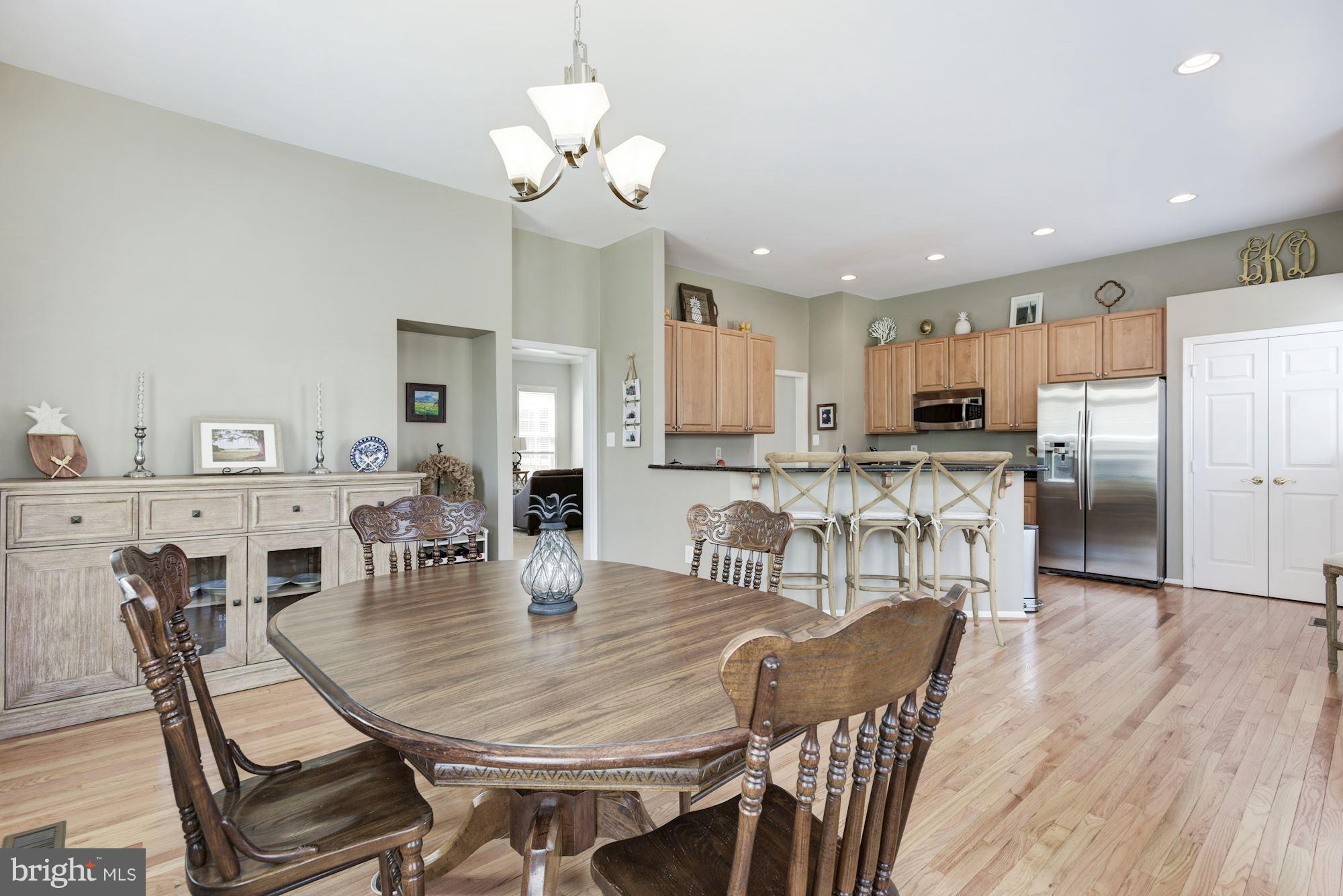 20709 Riptide Square Sterling, VA 20165 - Photo 12 of 30 a view of a dining room with furniture and wooden floor