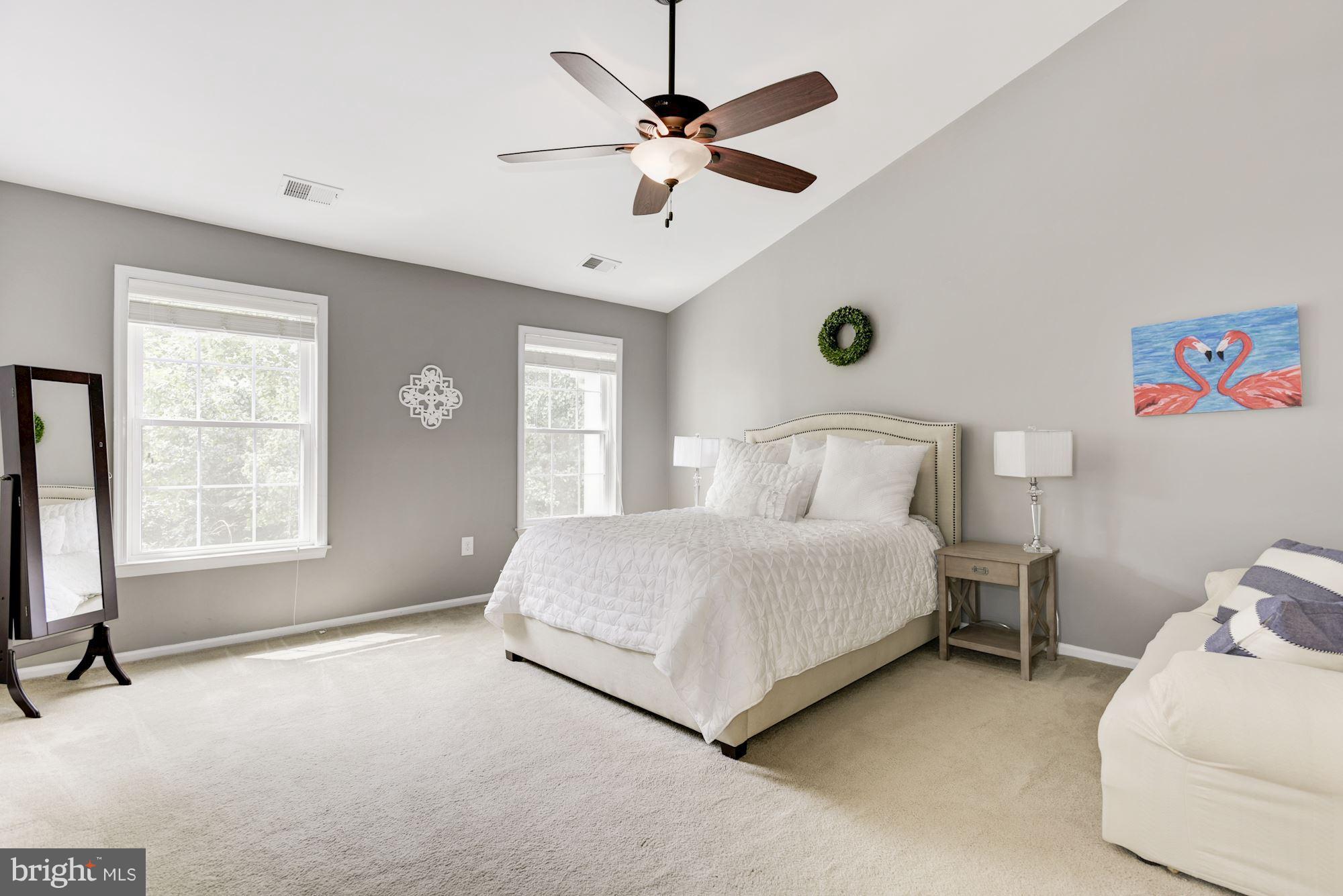 20709 Riptide Square Sterling, VA 20165 - Photo 16 of 30 a bedroom with a bed and window