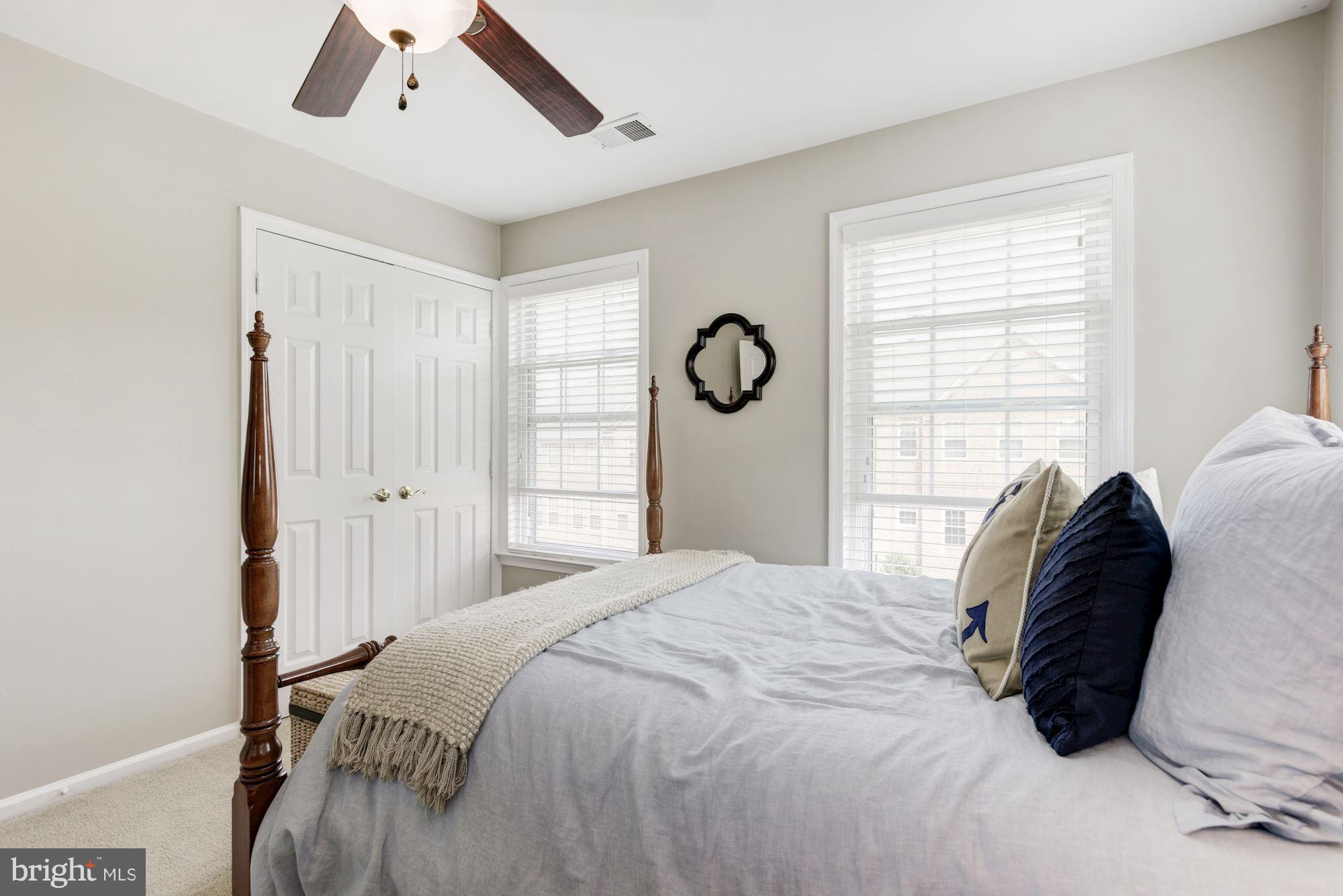 20709 Riptide Square Sterling, VA 20165 - Photo 21 of 30 a bedroom with a bed and a window