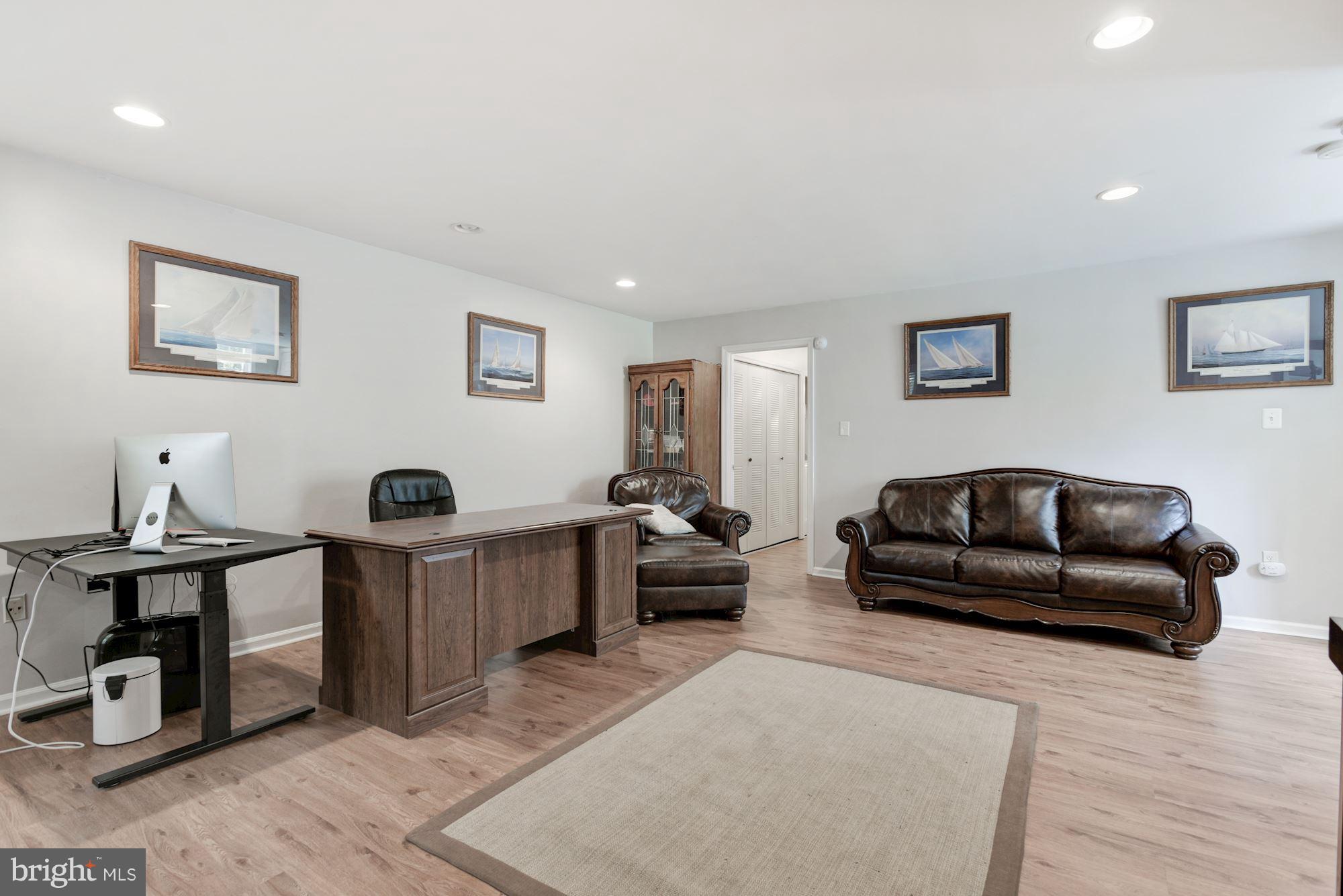 20709 Riptide Square Sterling, VA 20165 - Photo 26 of 30 a living room with furniture and a wooden floor