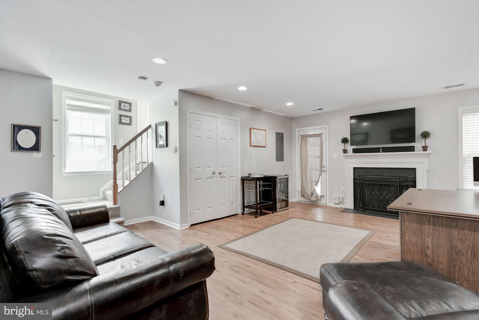 20709 Riptide Square Sterling, VA 20165 - Photo 27 of 30 a living room with furniture and a fireplace