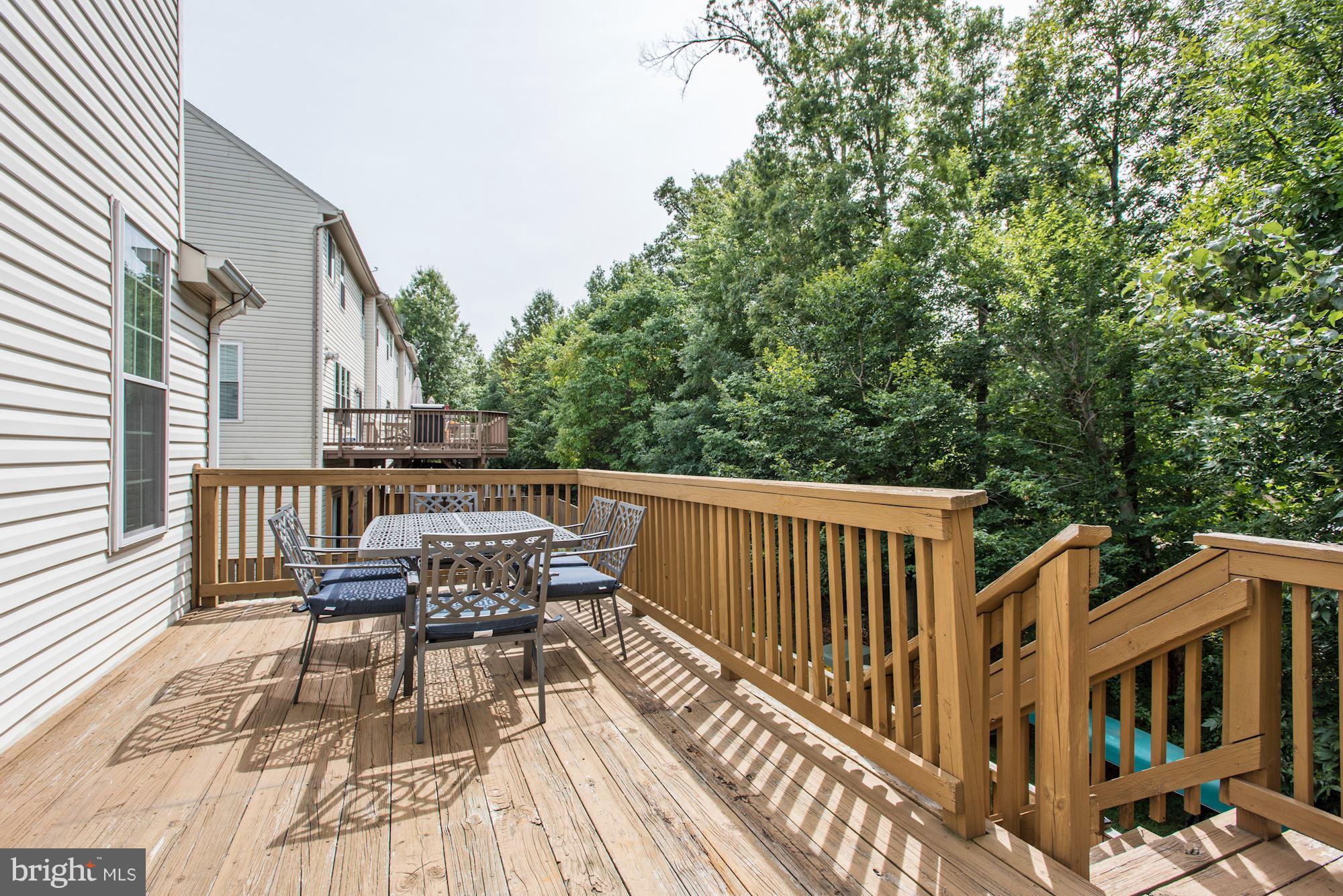 20709 Riptide Square Sterling, VA 20165 - Photo 30 of 30 a balcony with wooden floor and outdoor seating