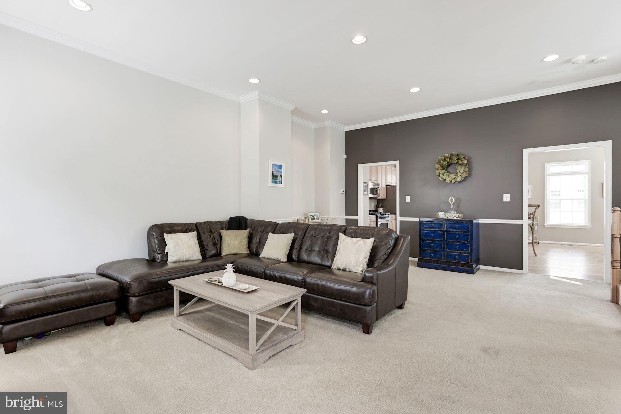 20709 Riptide Square Sterling, VA 20165 - Photo 6 of 30 a living room with furniture and wooden floor