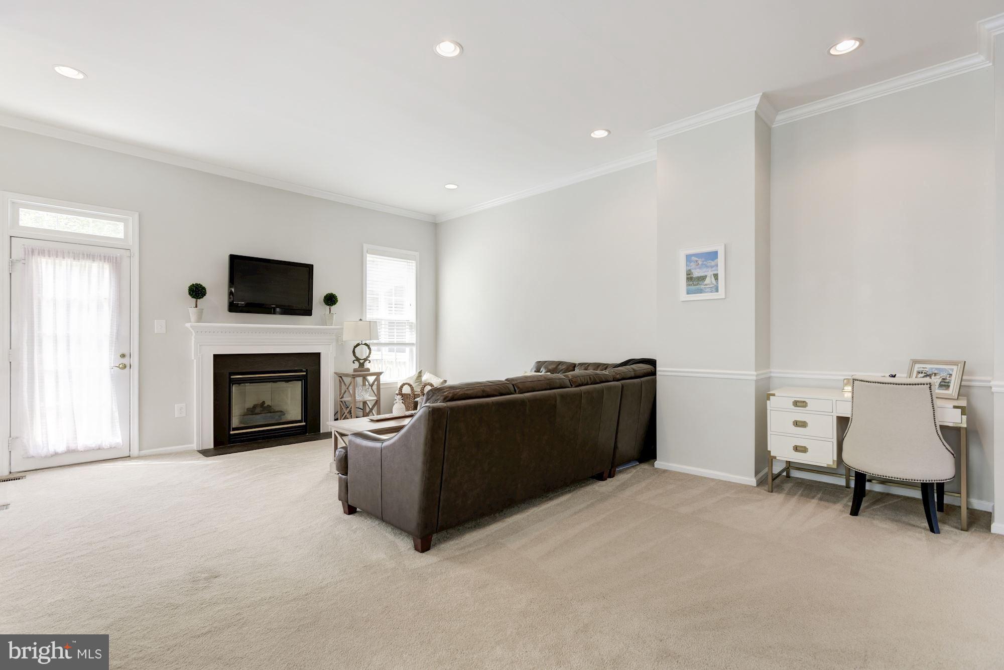 20709 Riptide Square Sterling, VA 20165 - Photo 8 of 30 a living room with furniture and a fireplace