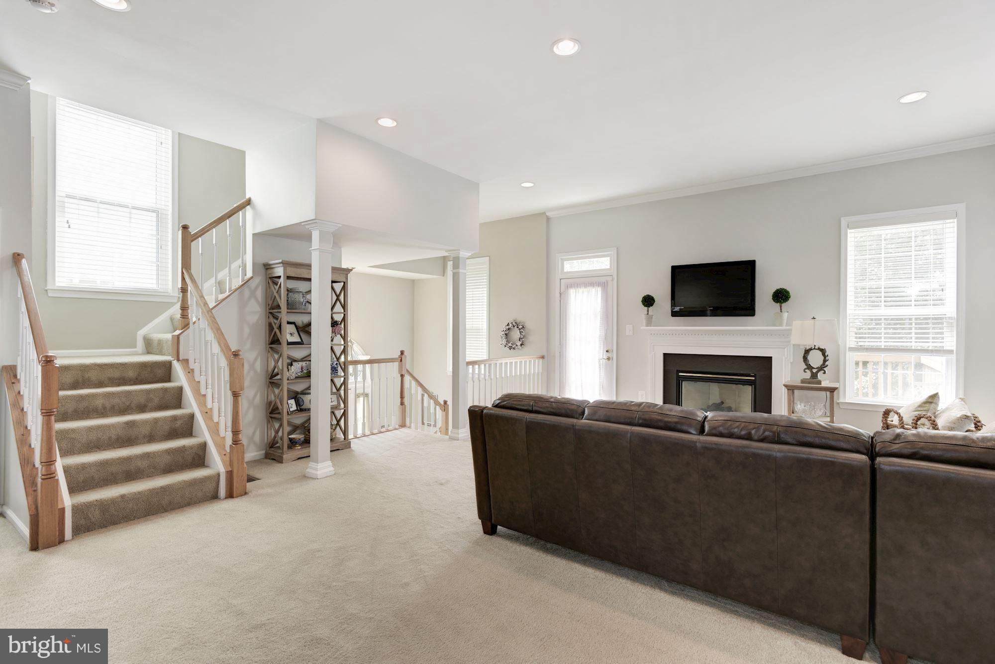 20709 Riptide Square Sterling, VA 20165 - Photo 9 of 30 a living room with furniture and a fireplace