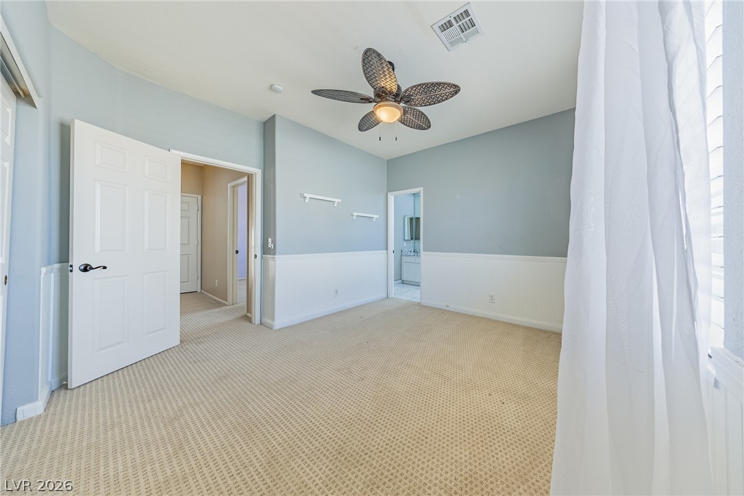 2504 Putting Green Drive Henderson, NV 89074 - Photo 33 of 56 Bright and airy, this room offers comfort and style with its inviting atmosphere.